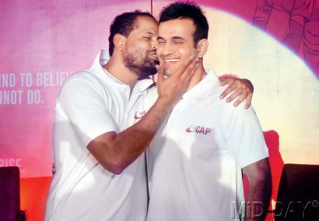 Yusuf Pathan kisses brother Irfan during the launch of their Cricket Academy in CCI yesterday. Pic/Suresh KK