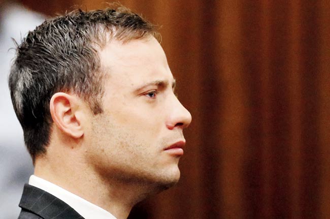 Paralympian Oscar Pistorius listens to the verdict in his trial at the Pretoria High Court on Thursday. Pic/AFP