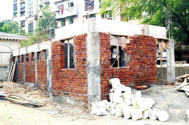 Both the beat chowki (top, right) and the public urinals are to be housed in a single structure that the BMC is currently building in the Antop Hill bus depot compound. All that separates the public loos from the chowki is the wall in between. 