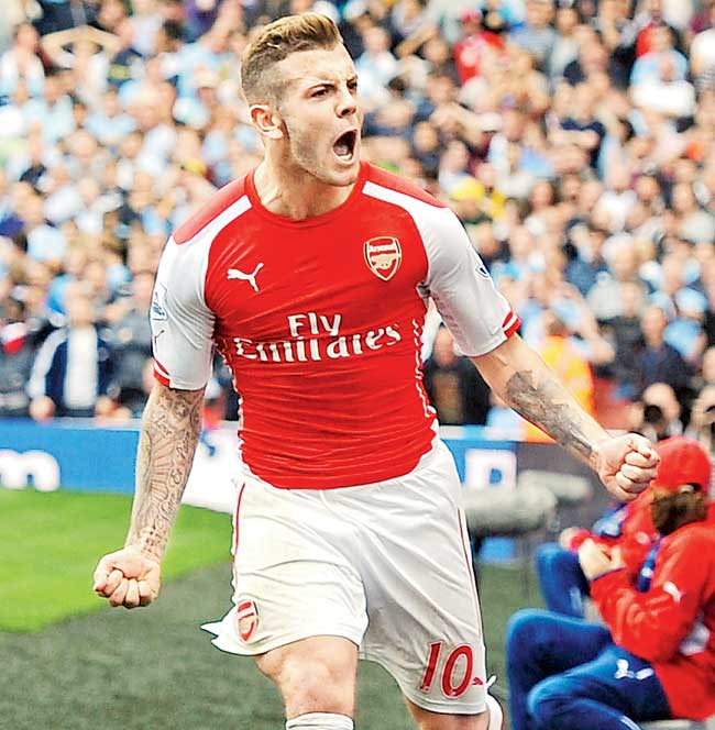 Jack Wilshere celebrates after scoring vs Man City. Pic/Getty Images  