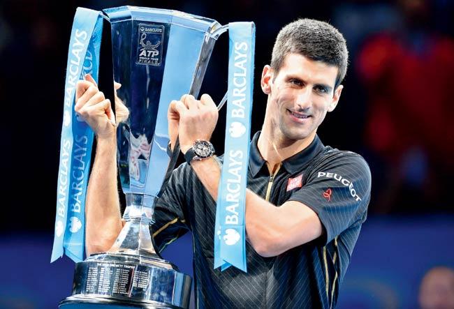 Novak Djokovic lifts the ATP World Tour Finals trophy at London