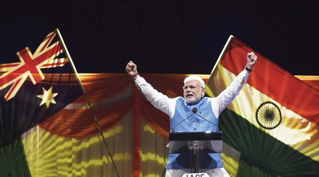 Prime Minster Narendra Modi acknowledged thousands of supporters at the Allphones Arena Olympic park in Sydney on November 17. Thousands of Indian community members gathered at the arena to listen to Modi who was in Sydney after attending the G20 Summit in Brisbane over the weekend. Pic/Getty Images