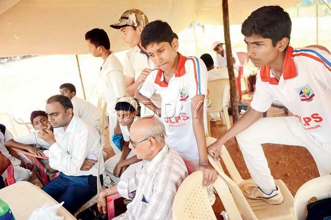 Dejected players of OLPS are seen in their tent after the Harris Shield match was called off yesterday at the Azad Maidan. Pic/Atul Kamble