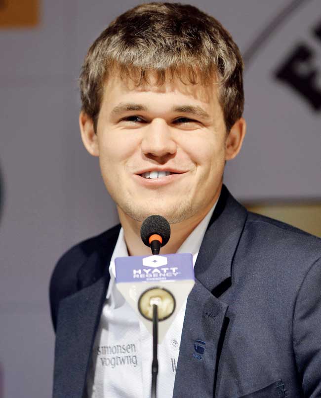 All Smiles: World Champion Magnus Carlsen smiles during a press conference after beating Viswanathan Anand in their World Championship Match series last year in Chennai. Pic/AFP