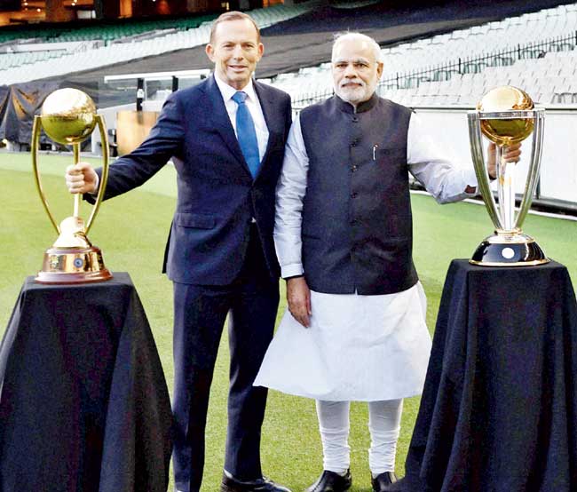 India Prime Minister Narendra Modi and his Australian counterpart Tony Abbott (left) at the Melbourne Cricket Ground yesterday. Pic/PTI