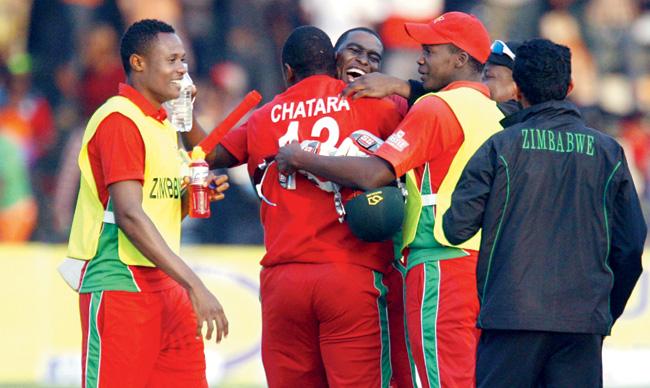 Zimbabwe players are ecstatic after beating Australia in the ODI tri-series at Harare yesterday. Pics/AFP