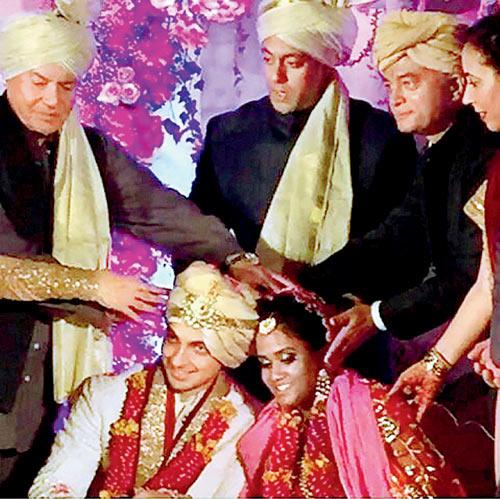 From left: Salim Khan, Salman Khan and Aayush Sharma’s parents shower blessings on the couple