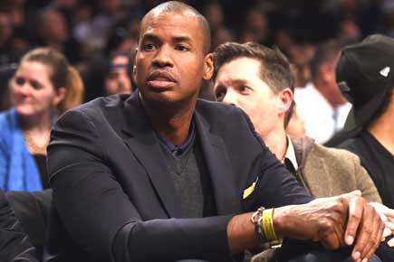 Jason Collins, who made history by coming out, announces NBA retirement