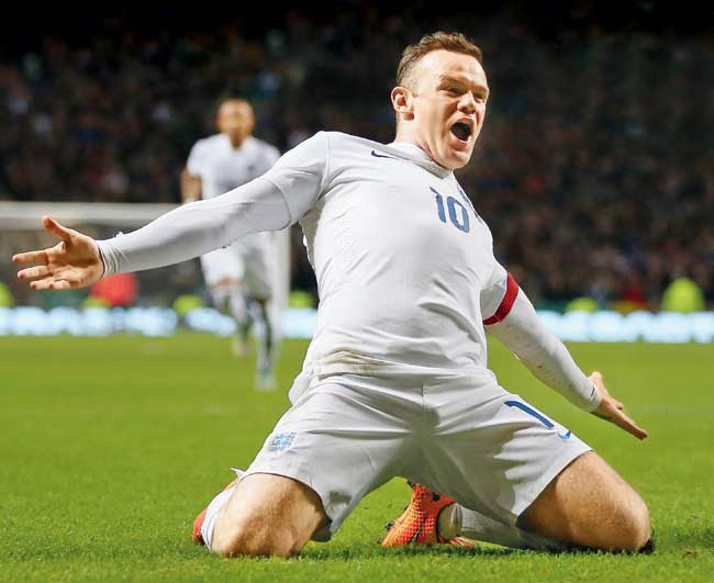 England skipper Wayne Rooney celebrates his goal against Scotland at Celtic Park on Tuesday. Pic/AFP