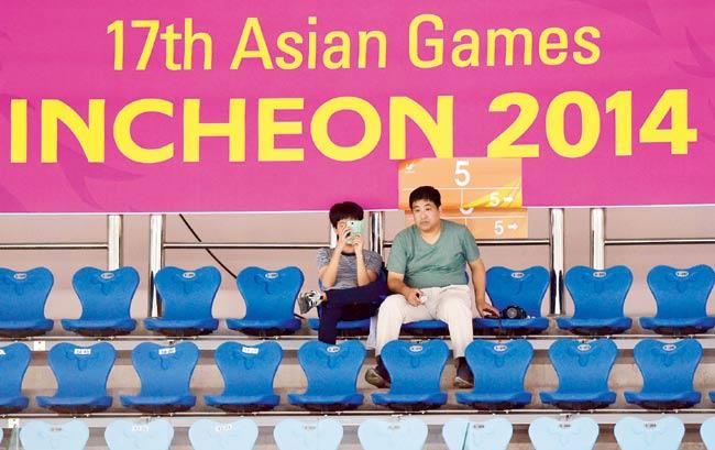 These spectators have no company during the women’s badminton event at the Asian Games in Incheon on Saturday. Pic/AFP