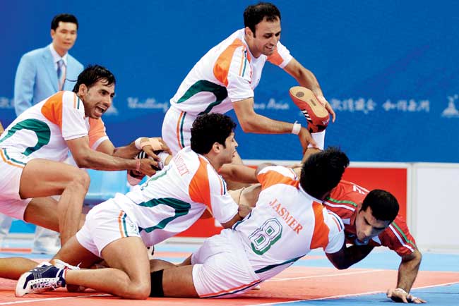 Indian players tackle an Iranian at the 2010 Asian Games in Guangzhou. Pic/Getty Images