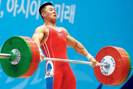 Asian Games: Triple-record for North Korean lifter Kim Un-Guk