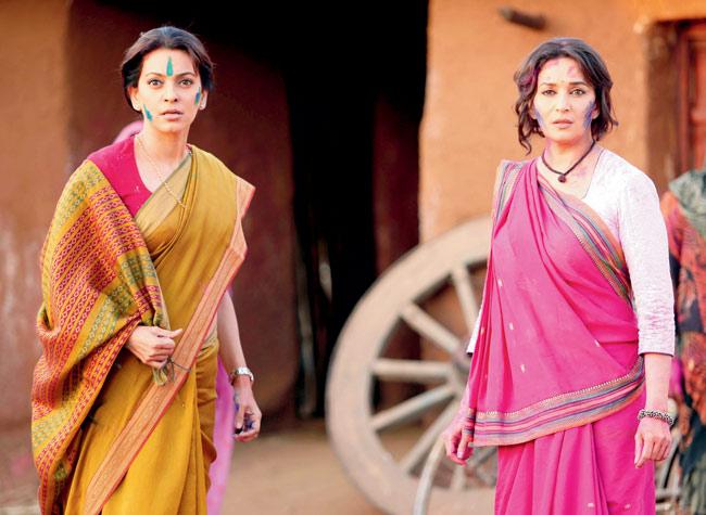 Juhi Chawla and Madhuri Dixit in Gulaab Gang, where pink saree-clad women deal with matters in their own way
