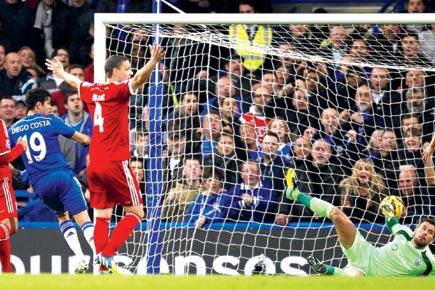 Chelsea's striker Diego Costa (second from left) scores the opening goal against West Bromwich Albion at Stamford Bridge on Saturday