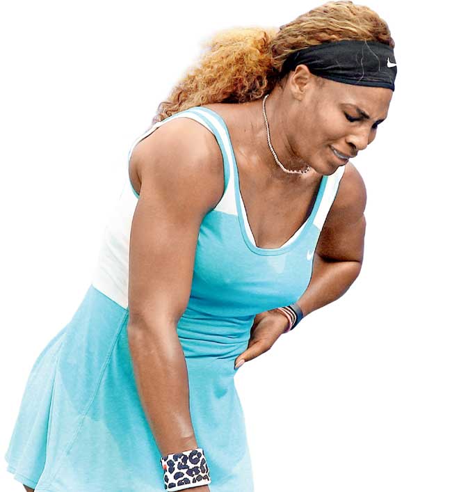 Serena Williams is in obvious discomfort during the match. Pics/AFP