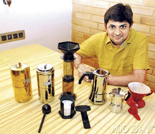 Mumbai-based brewing expert Jignesh Shah with the three coffee-making equipments (from left to right) the Indian Filter Coffee Maker (in brass and steel), Aero Press and the Moka Pot. Pics/Shadab Khan