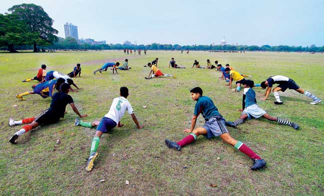 Young footballers practice at a Kolkata maidan. Pic for representation