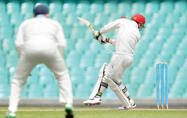 Phil Hughes (right) is struck in the head by the fateful delivery that claimed his life at Sydney Cricket Ground. Pic/Getty Images 