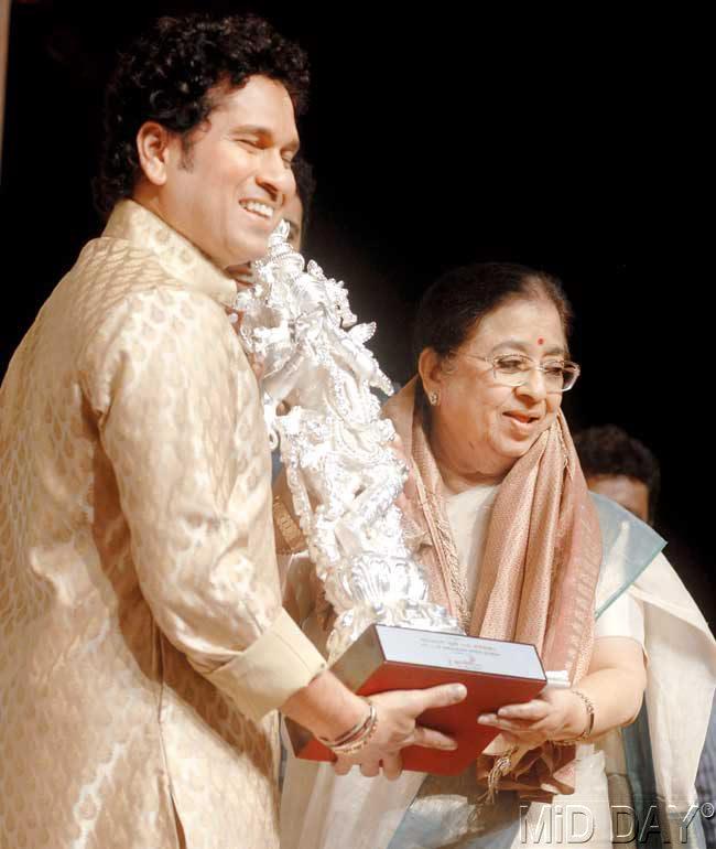 Cricket icon Sachin Tendulkar with Lata Mangeshkar-s sister Usha at Shanmukhan-anda Hall in Matunga yesterday. Tendulkar attended a function to felicitate Lata Mangeshkar on her 85th birthday, but the melody queen could not be present due to ill health. Pic/Rane Ashish