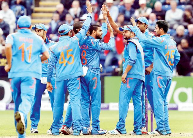 India players celebrate an English wicket during the second ODI in Cardiff last week. Pic/AFP