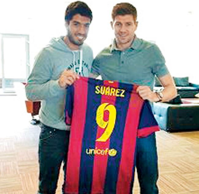 A picture Gerrard posted on Instagram of him holding a signed  Barcelona jersey alongside Luis Suarez