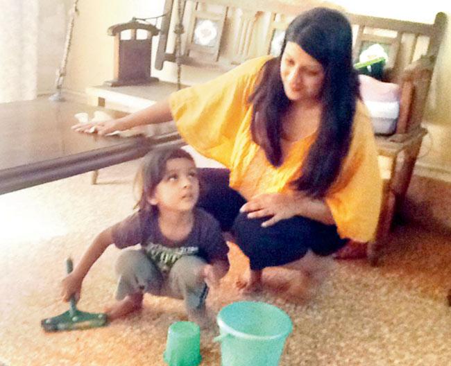 MOP FOR A MOPPET: Amy Shah gives son, Swayam Shah, a lesson in Sojee Science