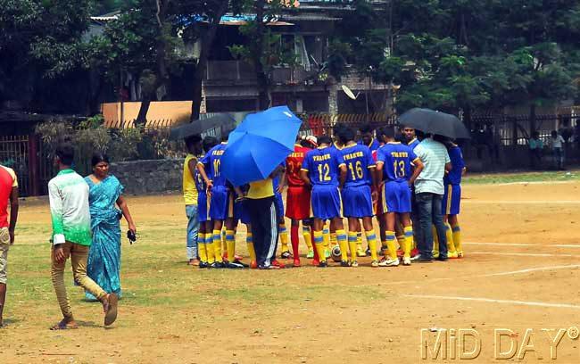Football players of Thakur college hold a team meeting at Anna Bhau Sathe ground at Goregaon on Monday. Pic/Sayyed Sameer Abedi