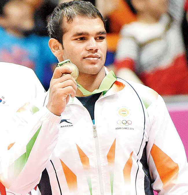 Narsingh Yadav poses with his bronze medal yesterday