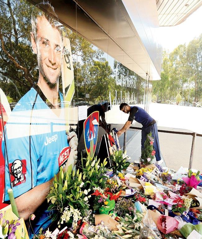 India captain Virat Kohli leaves a bat and cap at a memorial for Phillip Hughes outside the Adelaide Oval on Saturday. Pic/Getty Images