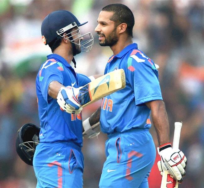 Cuttack: Indian batsman Shikhar Dhawan hugs Ajinkya Rahane after completing his century during 1st ODI match against Sri Lanka in Cuttack. Pic/AFP
