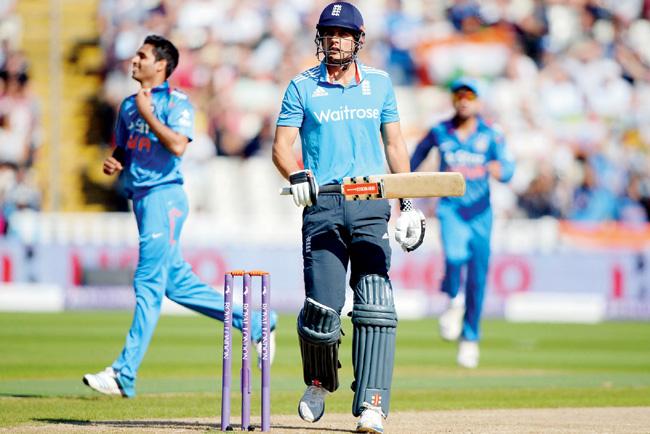 Bhuvneshwar Kumar celebrates the wicket of Alastair Cook
