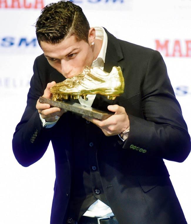 Cristiano Ronaldo with the Golden Boot in Madrid yesterday