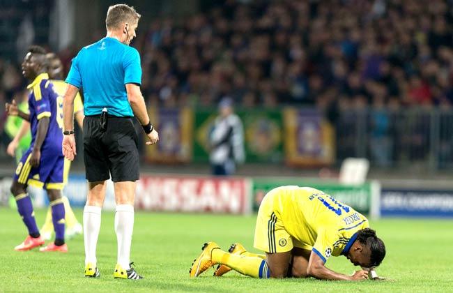 Didier Drogba (R) of Chelsea lies on the ground after he was injured during the UEFA Champions League Group G football match between NK Maribor and Chelsea in Maribor, Slovenia. Pic/AFP