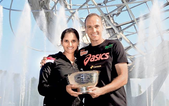 Sania Mirza and Bruno Soares pose with the US Open mixed doubles trophy at the Unisphere in New York on Friday. Pic/Getty Images