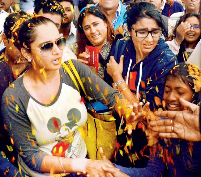 Sania Mirza showered with petals upon her return to Hyderabad from the US yesterday. Pic/PTI