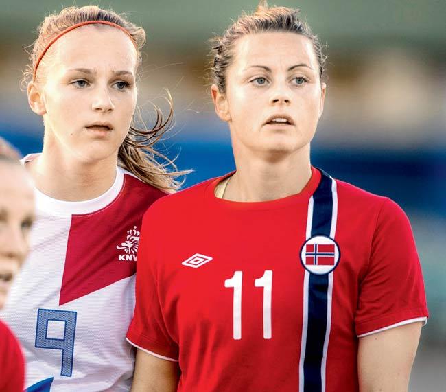 Women footballers Vivianne Miedema of the Netherlands and Nora Holstad Berge (right) of Norway during the FIFA World cup qualifier in Oslo, Norway on September 17, 2014. Pic for representation only