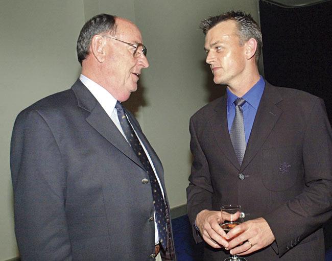 Ian Meckiff of the 1960-61 Australian team (left) with Australian hero Adam Gilchrist at the Brisbane Convention Centre in Brisbane. They were in Brisbane as part of the 40th anniversary celebrations of the Tied Test during the 1960-61 West Indies cricket tour of Australia