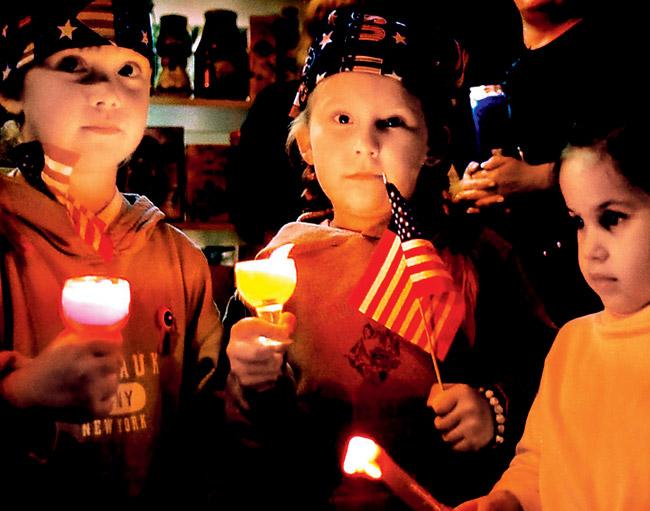 Children at Ground Zero at a candlelight march after the attacks 