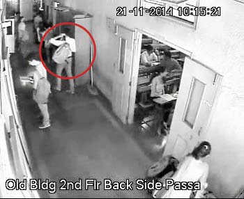 The accused is then seen walking away with the bag