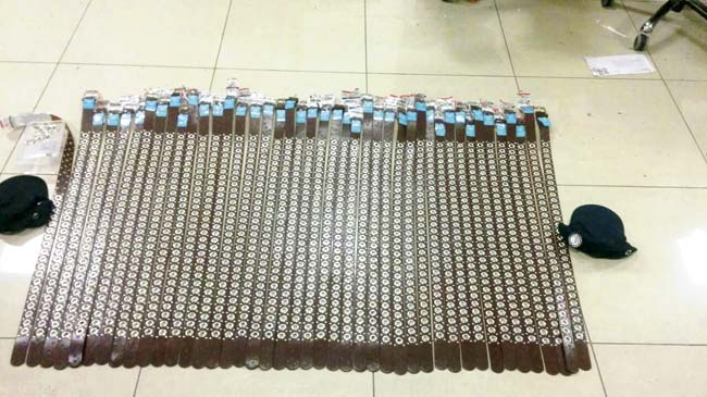 The belt tightens: After AIU officials found 4 kg of the yellow metal concealed as wires inside the eyelets of the belts and hats, they arrested the two men who had exchanged the bag