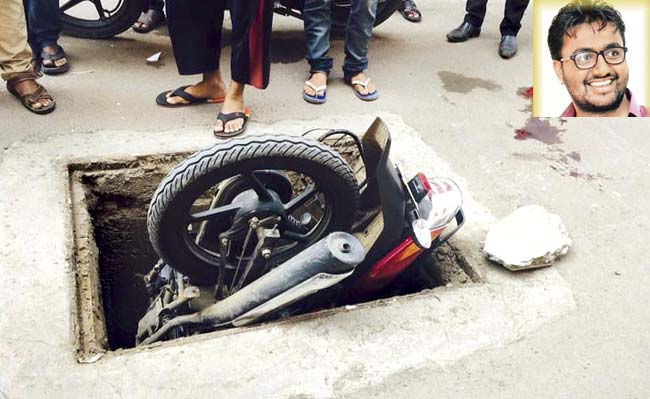 The bike was stuck in the manhole for four hours before traffic police managed to retrieve it and Mahendra Rajepure took Ganesh Taware, who injured his face and ears, to a hospital