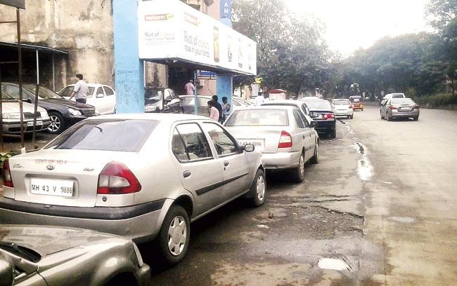 In many places, second-hand cars are parked on the footpath as well, making it difficult for pedestrians to walk