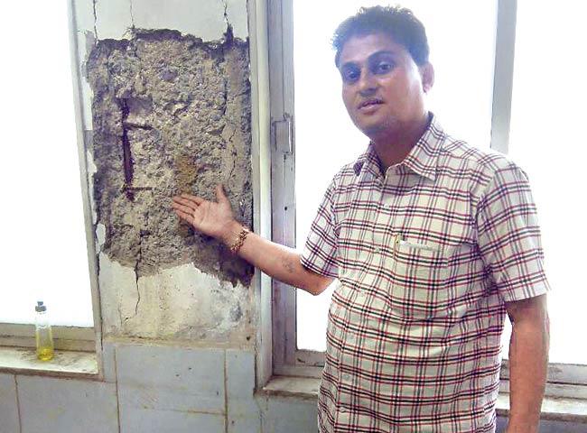 Corporator Cyril D’souza, showing cracks inside a building, has alleged that Devendra Kumar Jain, assistant municipal commissioner of P/North ward, colluded with builders to demolish even structurally fit buildings last year