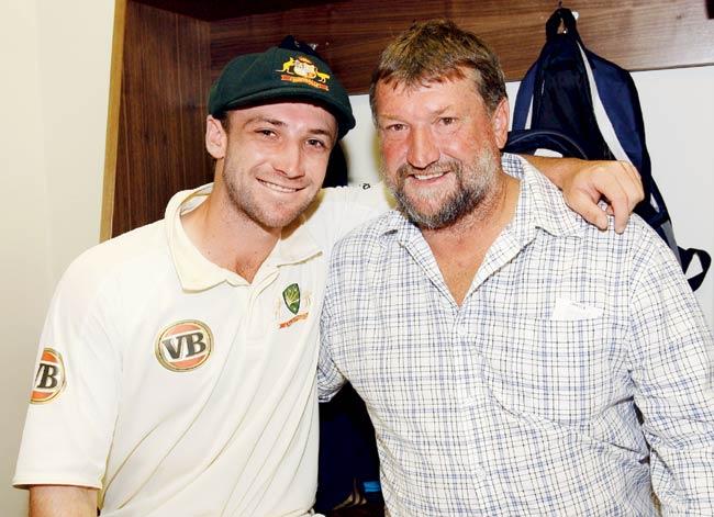 Test debutant Phillip Hughes with his father Greg after Australia beat South Africa at the Wanderers in March 2009