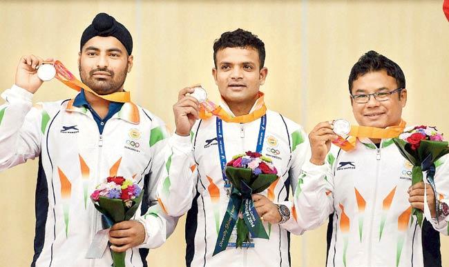 Gurpreet Singh (extreme left), Vijay Kumar and Pemba Tamang with their silver medals