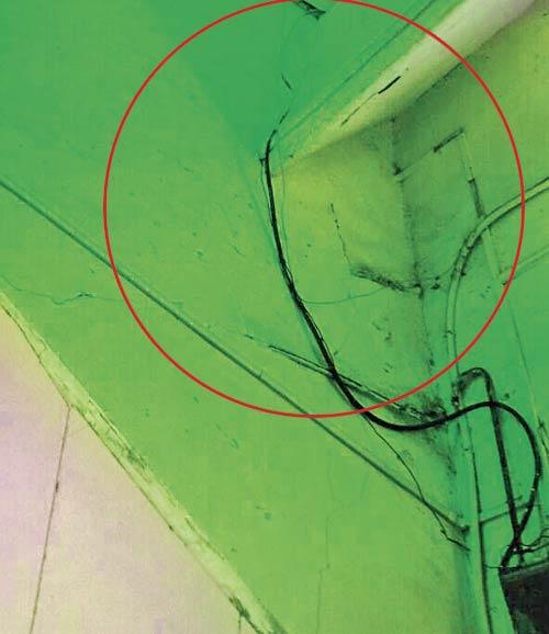 The spot (circled) where the youth’s body was found hanging from the electrical wires installed above the staircase leading to the psychiatry department research office