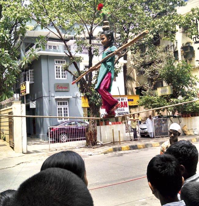 A small crowd gathered to watch this little girl perform daredevil stunts