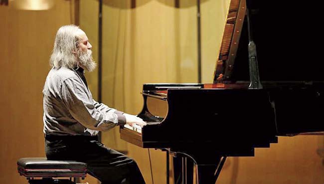 Ukrainian pianist Lubomyr Melnyk frequently slips into a trance during performances. He can play three-hour-long compositions by solely relying on his memory. Pic/AFP