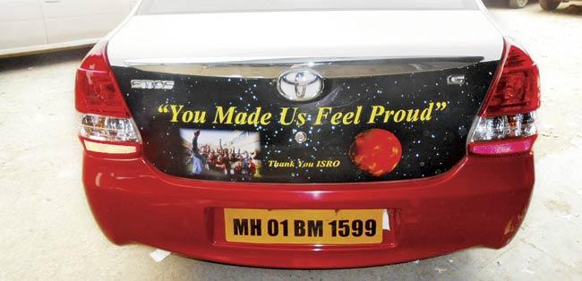 The taxis bearing congratulatory messages for the Mars mission team