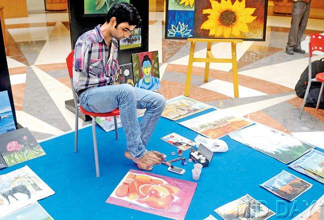 FOOT FIRST: Nadeem Shaikh paints at Inorbit Mall, Malad